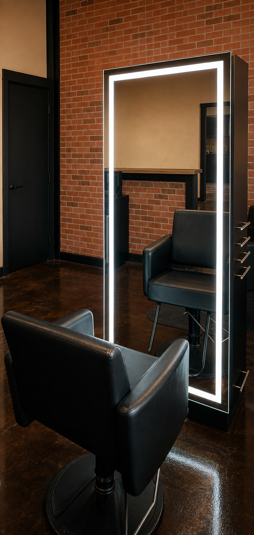 Illuminated styling mirror and chairs inside Fort Worth Hair & Co.